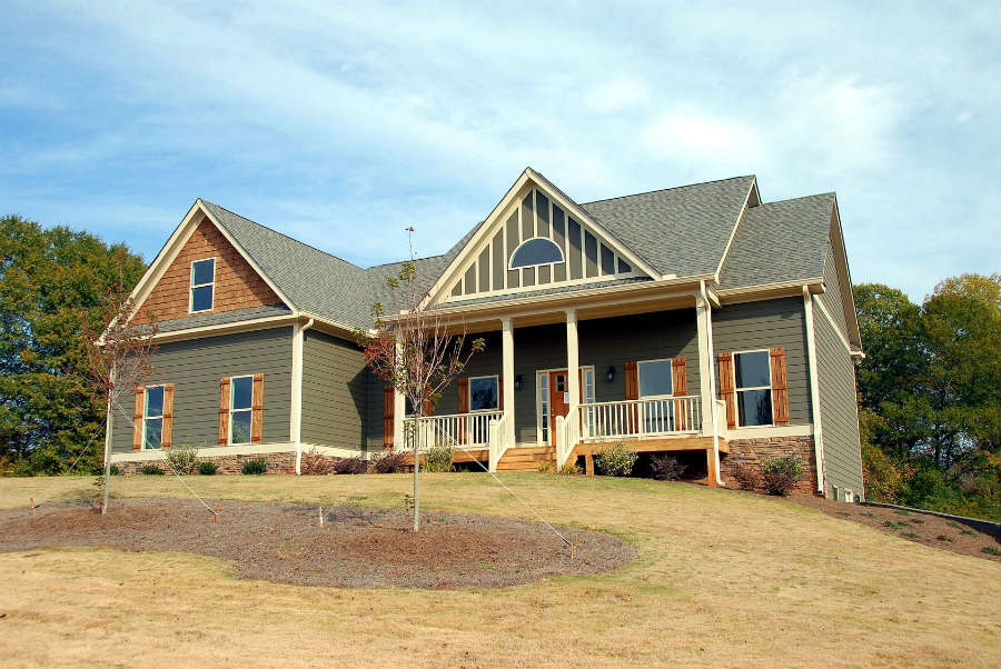 A large house with a lot of windows and doors.