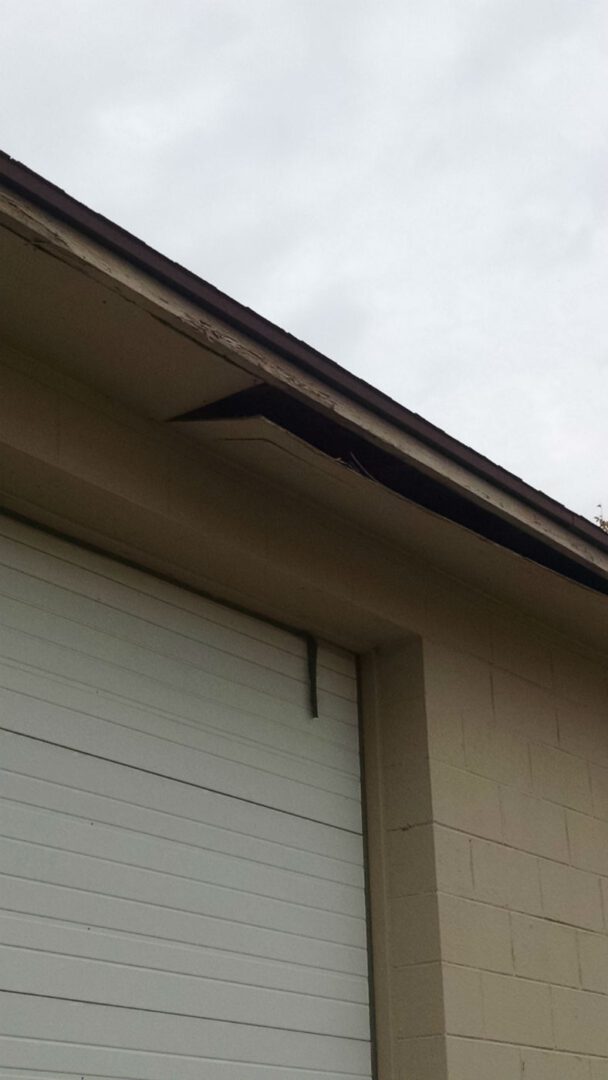 A garage door with the roof missing.