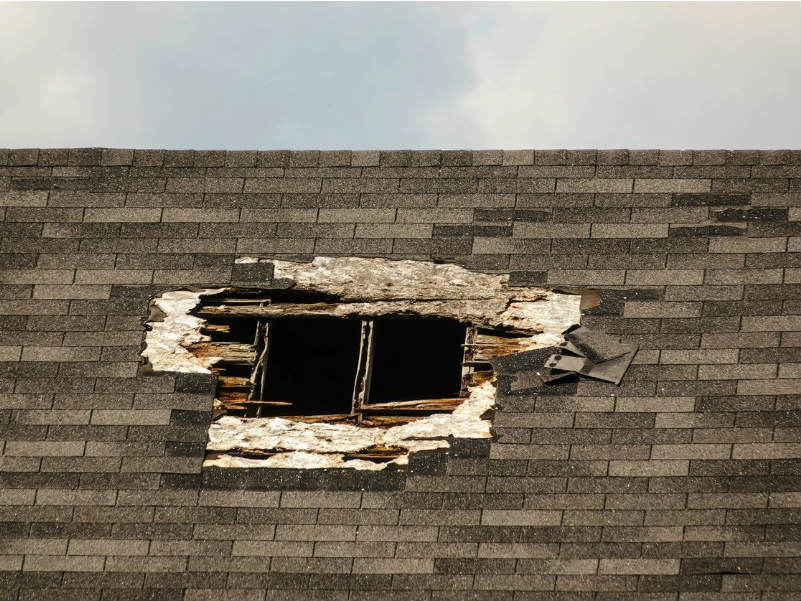 A hole in the roof of a building that has been torn down.