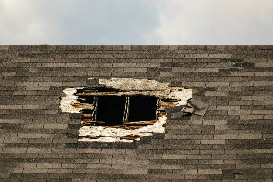 Weathered shingled roof with exposed rafters