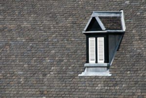 A window on the side of a roof.