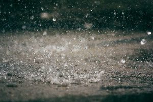 A close up of water splashing on the ground