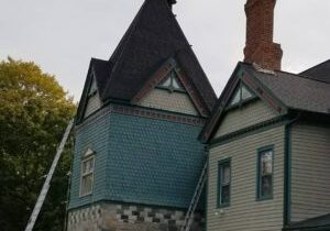 Expert roofer completing a new roof installation project on site.